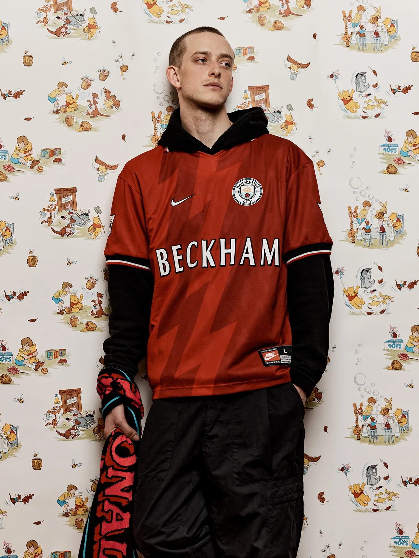 Neil Bedford photographs a male model in football shirts made in error. Designed to create debate online.
